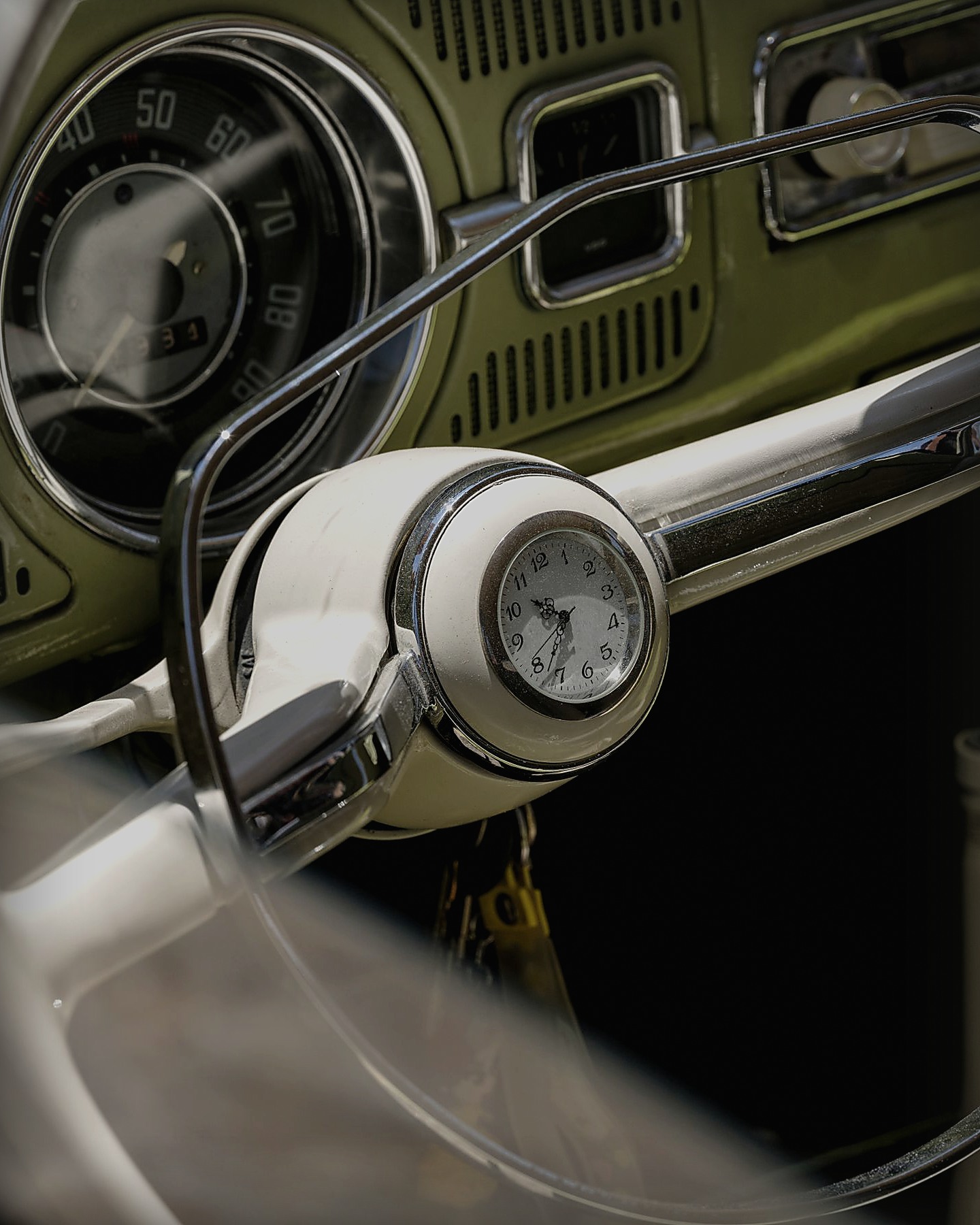Steering wheel, gauges and dashboard inside a vintage car