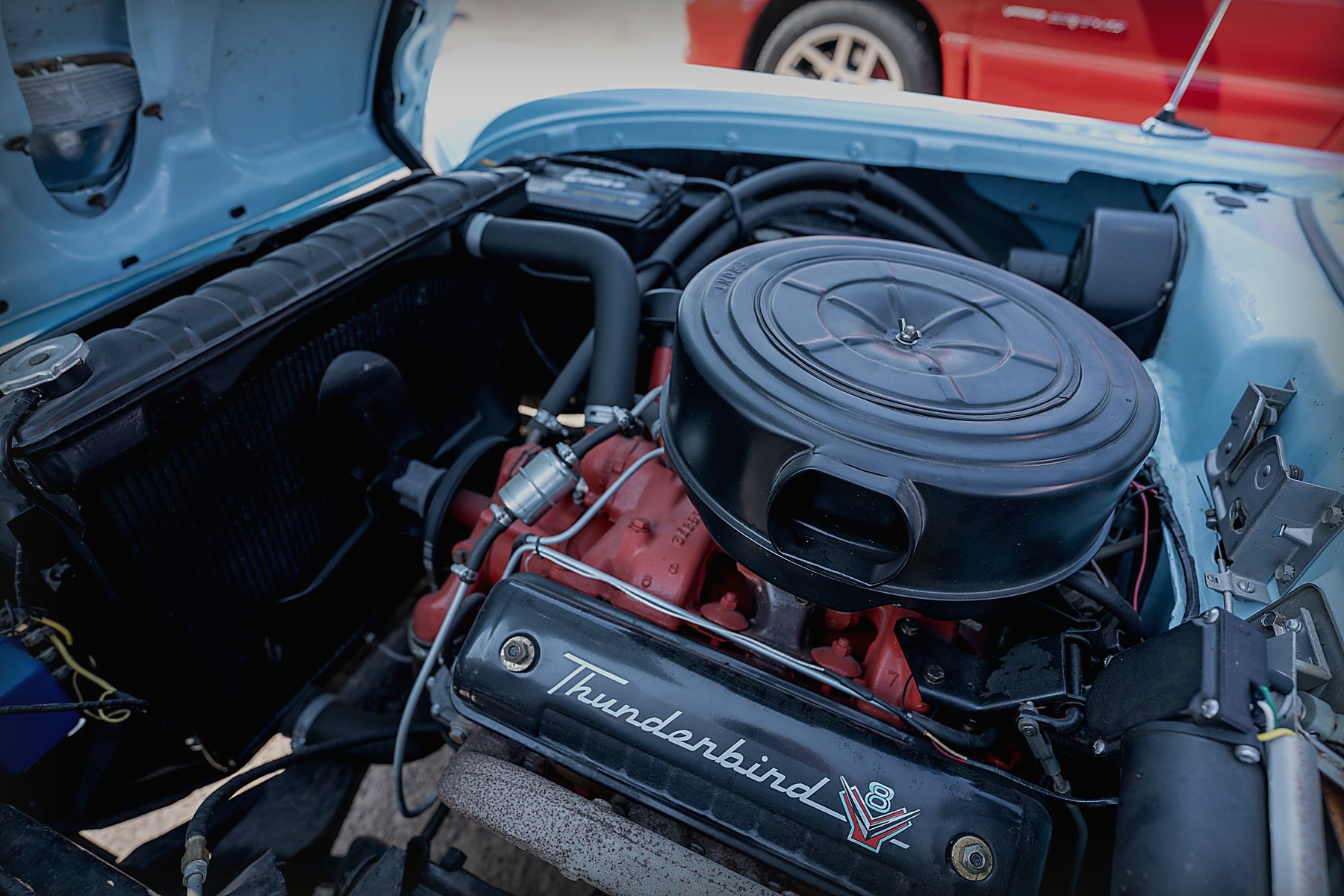 Close view of an engine bay inside a vintage car