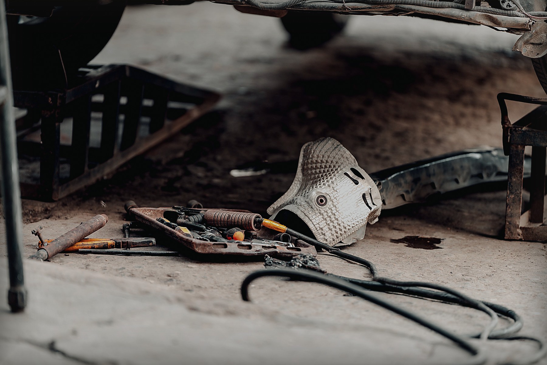 Automotive tools arranged inside a working garage
